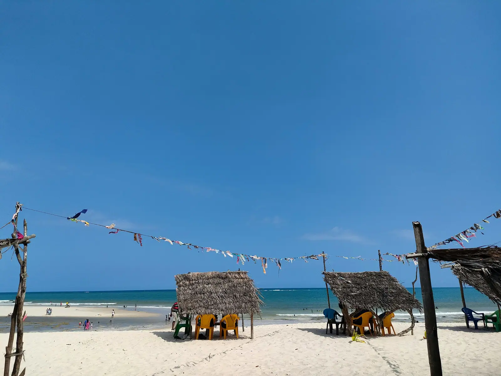 White sand and thatched bandas on Diani Beach