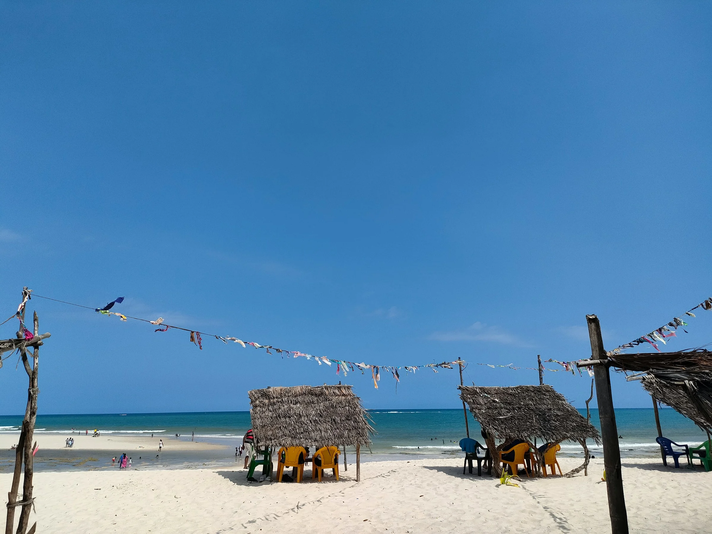 White sand and thatched bandas on Diani Beach